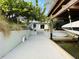 Backyard featuring a patio, steps to a boat dock, and a boat under a canopy at 124 Godfrey Rd, Edgewater, FL 32141