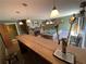Entertaining basement with a long bar, pool table, and fireplace at 124 Godfrey Rd, Edgewater, FL 32141