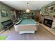 Recreational basement featuring a pool table, fireplace, and bar area at 124 Godfrey Rd, Edgewater, FL 32141