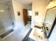 Bathroom with a tub shower, a double sink vanity, and an open door to another room at 124 Godfrey Rd, Edgewater, FL 32141