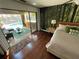 Bedroom featuring a walkout to a covered patio and pool area at 124 Godfrey Rd, Edgewater, FL 32141