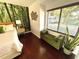 Bright bedroom with large windows and comfortable seating area at 124 Godfrey Rd, Edgewater, FL 32141