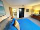 Comfortable bedroom with blue bedding and access to the hallway at 124 Godfrey Rd, Edgewater, FL 32141