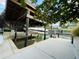 A boat sits in a covered lift at the dock, with the water accessible for boating, enhancing the property's waterfront appeal at 124 Godfrey Rd, Edgewater, FL 32141