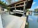 Covered boat dock with a boat lift, making it easy to store and access your boat right from your backyard at 124 Godfrey Rd, Edgewater, FL 32141
