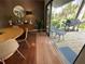 Dining area with a table, chairs, and access to a deck with a grill and furniture at 124 Godfrey Rd, Edgewater, FL 32141
