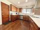 Cozy kitchen featuring wooden cabinets, stainless appliances, and hardwood floors at 124 Godfrey Rd, Edgewater, FL 32141