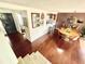Bright and airy living area with a dining area, staircase, and modern decor at 124 Godfrey Rd, Edgewater, FL 32141
