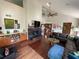 Spacious living room featuring high ceilings, a fireplace, and dark hardwood floors at 124 Godfrey Rd, Edgewater, FL 32141