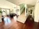 Spacious living room with an open floor plan, vaulted ceiling, and staircase at 124 Godfrey Rd, Edgewater, FL 32141