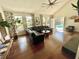Relax in this spacious living area with floor to ceiling windows and a view of the sparkling pool at 124 Godfrey Rd, Edgewater, FL 32141