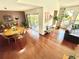 Bright living room area with open floor plan to dining area and outdoor views at 124 Godfrey Rd, Edgewater, FL 32141