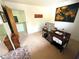 Home office with a work desk, a window, and access to the hallway at 124 Godfrey Rd, Edgewater, FL 32141