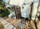 Inviting outdoor shower space with stone pavers, wood base and door, and convenient shower head at 124 Godfrey Rd, Edgewater, FL 32141