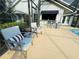 Relaxing outdoor patio with comfortable seating and a convenient bar area, perfect for poolside relaxation at 124 Godfrey Rd, Edgewater, FL 32141