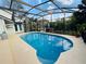 Private screened-in pool area with ample space for lounging and a seamless connection to the outdoors at 124 Godfrey Rd, Edgewater, FL 32141