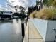 A canal view showcasing the waterfront property with landscaping along the water edge, enhancing its appeal at 124 Godfrey Rd, Edgewater, FL 32141