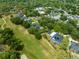 An aerial view of a home situated in a neighborhood that is adjacent to the local golf course at 1312 Winter Springs Blvd, Winter Springs, FL 32708