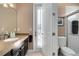 Bathroom featuring a granite countertop, neutral walls, and a step-in shower at 1312 Winter Springs Blvd, Winter Springs, FL 32708