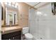 Bathroom featuring a granite countertop, a step-in shower with glass doors, and updated fixtures at 1312 Winter Springs Blvd, Winter Springs, FL 32708