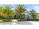 A view of a lovely home with palm trees in the front yard. Paved brick walkway to front doors at 1312 Winter Springs Blvd, Winter Springs, FL 32708