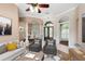 Cozy living room with neutral tones, plush seating, and an inviting view to the entry at 1312 Winter Springs Blvd, Winter Springs, FL 32708