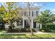 Charming home with a well-maintained lawn, landscaping, and inviting front porch at 14214 Shocklach Dr, Winter Garden, FL 34787