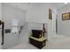 Hallway showcasing the staircase and a small table with a lamp, decorations, and framed art at 14214 Shocklach Dr, Winter Garden, FL 34787
