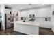 Bright kitchen with white cabinets, quartz counters, stainless steel appliances, and a functional island at 14214 Shocklach Dr, Winter Garden, FL 34787