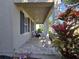 Long covered front porch with stone floors, dark shutters, and tropical landscaping at 14214 Shocklach Dr, Winter Garden, FL 34787