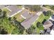 An aerial view of the well-maintained backyard and the unique architecture of this charming single-story home at 154 Desiree Aurora St, Winter Garden, FL 34787