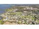 Aerial view of a neighborhood and lake with lush surroundings at 154 Desiree Aurora St, Winter Garden, FL 34787