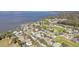 Aerial view of a neighborhood, with a lake in the background at 154 Desiree Aurora St, Winter Garden, FL 34787