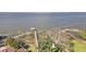 Aerial view of the tranquil lakefront, with private docks offering direct access for boating and water activities at 154 Desiree Aurora St, Winter Garden, FL 34787