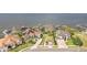 Aerial view showcases stunning lakefront homes, private docks, and lush landscaping in an exclusive neighborhood at 154 Desiree Aurora St, Winter Garden, FL 34787