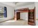 Bedroom with unique wooden loft bed design featuring built-in storage and staircase at 154 Desiree Aurora St, Winter Garden, FL 34787