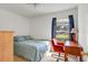 Bedroom features natural light from window, desk area, and simple decor at 154 Desiree Aurora St, Winter Garden, FL 34787