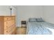 Cozy bedroom featuring neutral walls, and wood furniture at 154 Desiree Aurora St, Winter Garden, FL 34787