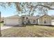 Charming single-story home with a well-maintained lawn and inviting facade at 154 Desiree Aurora St, Winter Garden, FL 34787