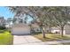 Charming single-Gathering home with a well-manicured front yard and attached two-car garage at 154 Desiree Aurora St, Winter Garden, FL 34787