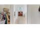 Hallway view with tile flooring, closet, and natural light from window at 154 Desiree Aurora St, Winter Garden, FL 34787