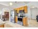 Efficient kitchen with stainless steel refrigerator and range, plus light wood cabinets at 154 Desiree Aurora St, Winter Garden, FL 34787