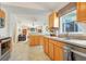 Open-concept kitchen with tile flooring that connects to a cozy living space at 154 Desiree Aurora St, Winter Garden, FL 34787