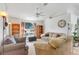 Spacious living room with neutral tones, comfortable seating, and large window views at 154 Desiree Aurora St, Winter Garden, FL 34787