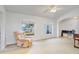 Bright and cozy living room with a comfortable recliner and neutral tones at 154 Desiree Aurora St, Winter Garden, FL 34787
