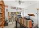 Office featuring custom wood bookcases and built in wood desk and natural light at 154 Desiree Aurora St, Winter Garden, FL 34787