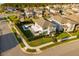 Aerial view of home featuring pool, covered patio, lawn, and established landscaping in a Gathering-friendly neighborhood at 16249 Taliesin St, Winter Garden, FL 34787