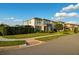 A contemporary two-story home featuring modern architectural details and a well-manicured lawn at 16249 Taliesin St, Winter Garden, FL 34787