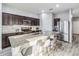 Modern kitchen featuring granite countertops, stainless steel appliances, and gray backsplash at 16390 Blooming Cherry Dr, Groveland, FL 34736