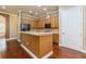 Well-equipped kitchen with stainless steel appliances, ample cabinet space, and breakfast bar at 182 Crepe Myrtle Dr, Groveland, FL 34736